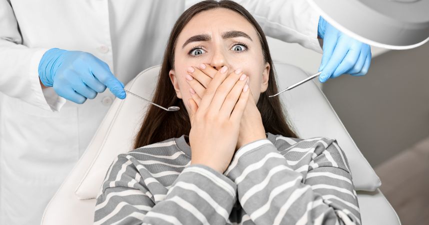 Woman expressing anxiety about dental treatment, highlighting common fears associated with dental visits and the importance of addressing dental anxiety.
