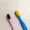 A new and a worn out tooth brush , side by side