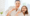 A Mother and her daughter brushing teeth together