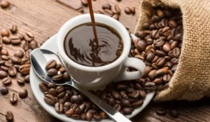 a freshly brewed black coffee, poured into a cup